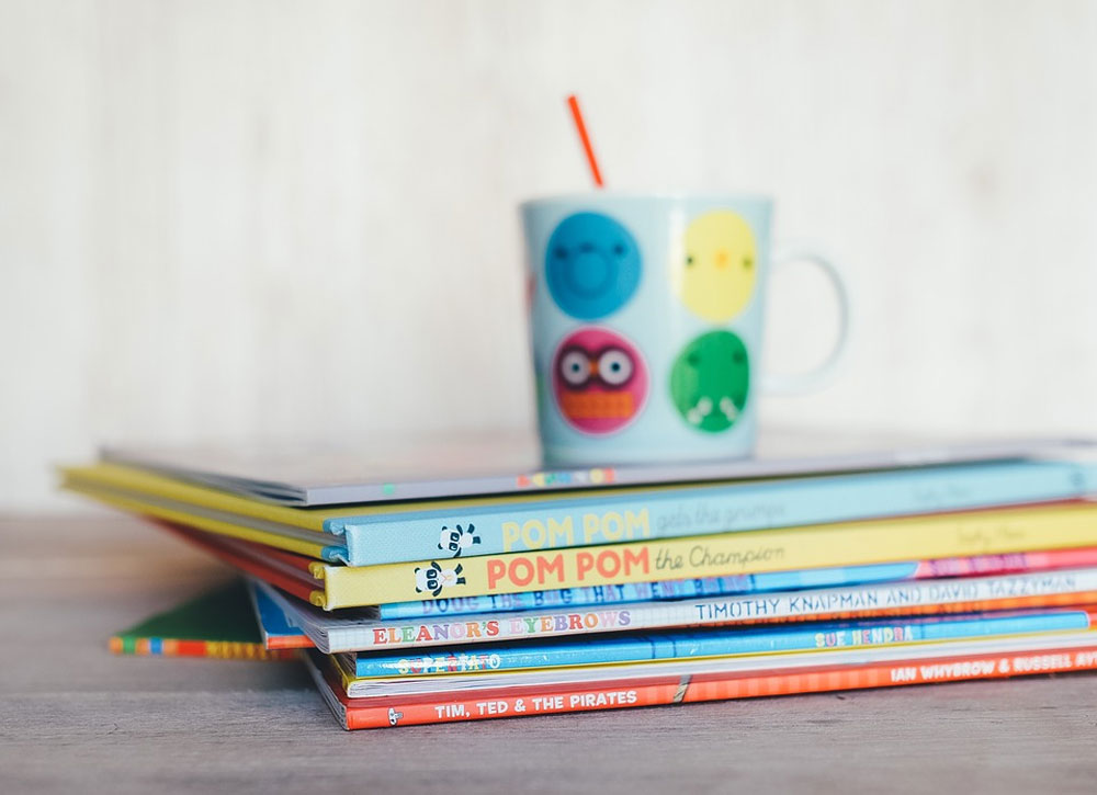 Stack of colorful children's books.