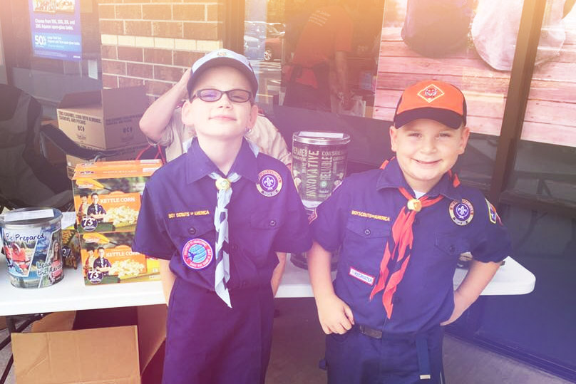 Girls in Boy Scouts selling Popcorn