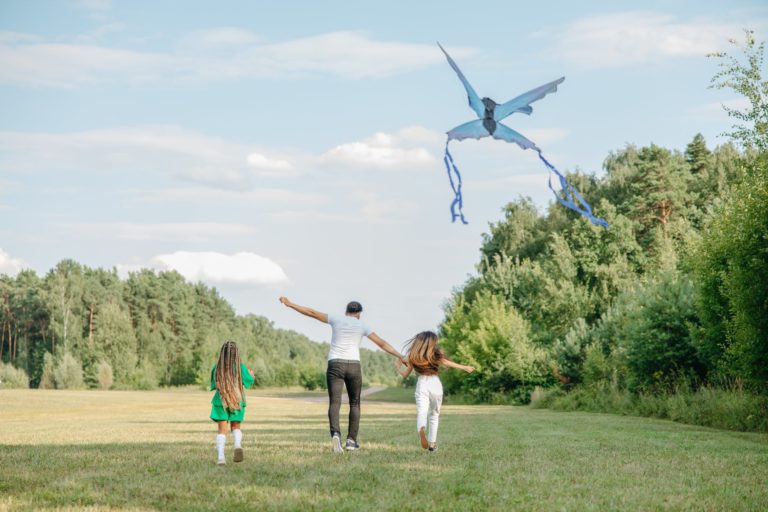 a family flying a kite