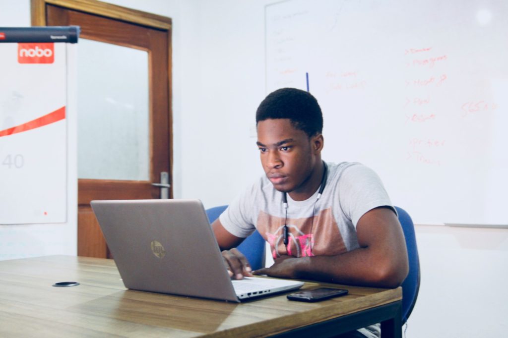 Teen Boy Typing on a laptop computer