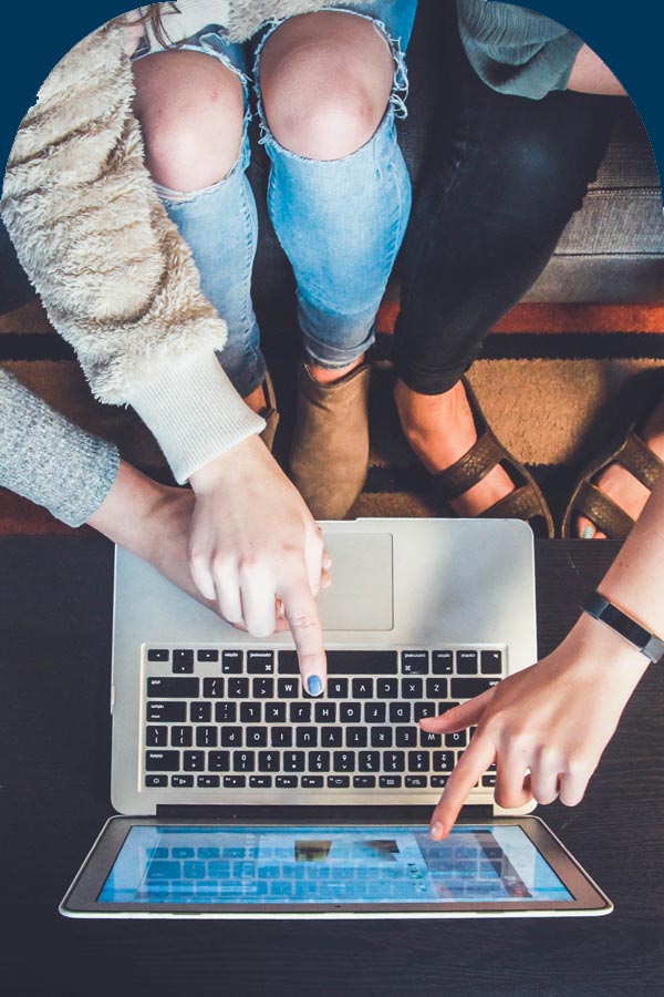 Women looking at printables on a laptop screen