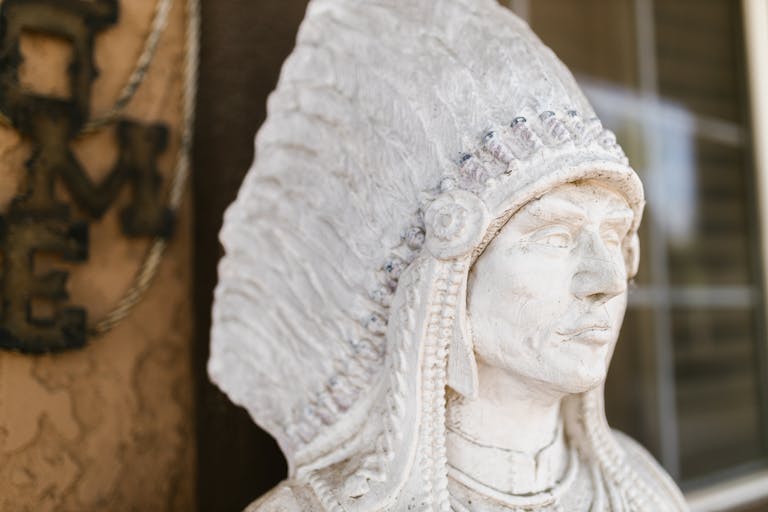 Close-Up Photo of a White Statue