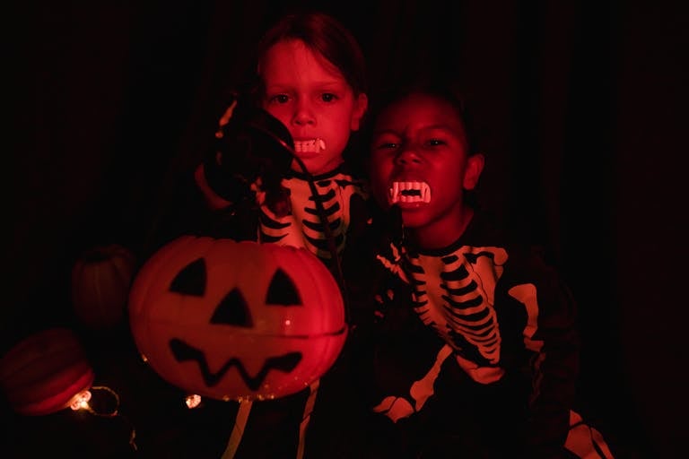 Two little girls in halloween costumes