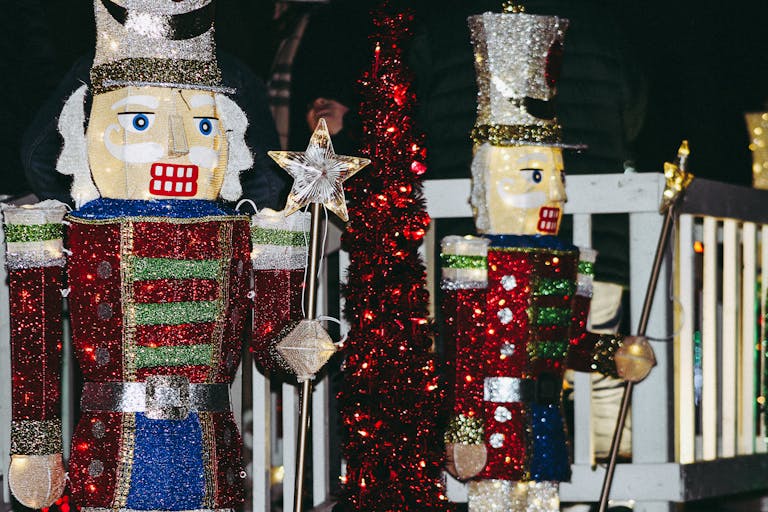 Bright and colorful nutcracker figures adorn a sparkling holiday scene, perfect for Christmas festivities.